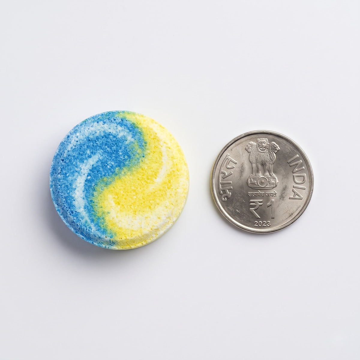 Magic Bubble tablet size comparison with coin
